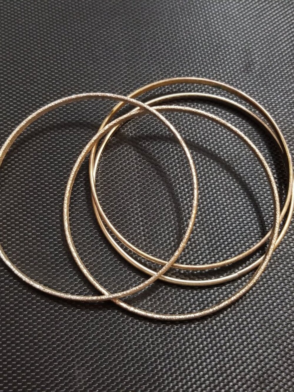 Four Gold-Tone Bangle-Bracelets